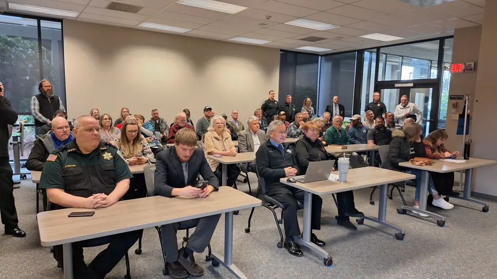 Citizens attending a Board of County Commissioners meeting in the county meeting room