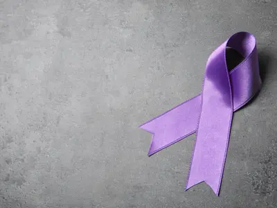 Purple awareness ribbon symbolizing support for domestic violence survivors