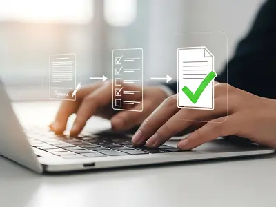 Person completing online forms on a laptop computer