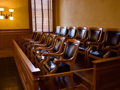 Empty jury box with chairs inside a courtroom