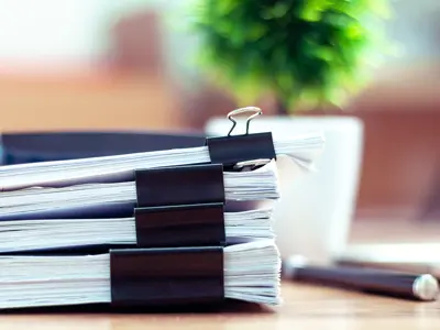 Paper stacks with binder clips